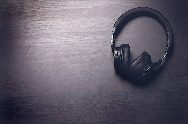istock Headphones on a dark background. Music accessories. 636315022