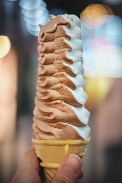 istock Hand Holding Cone of Ice Cream 636315654