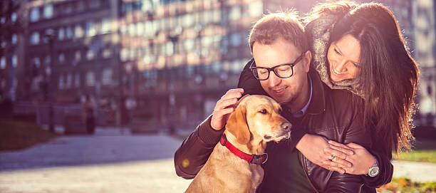istock Happy couple with a dog 636316252