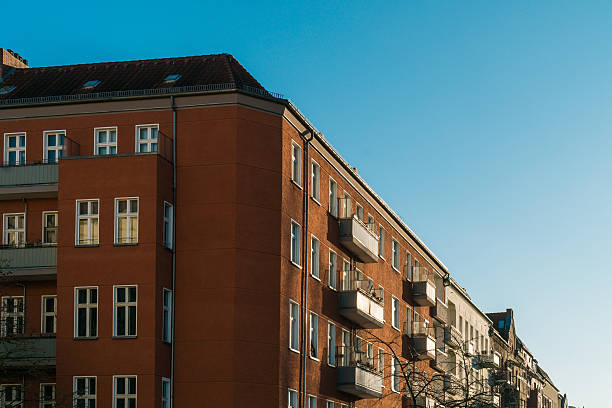 istock red and orange apartment building 636316256