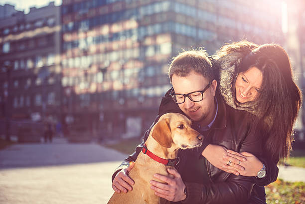istock Happy couple with a dog 636316314