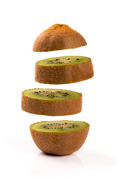 istock kiwi slices levitating on white background 636316684