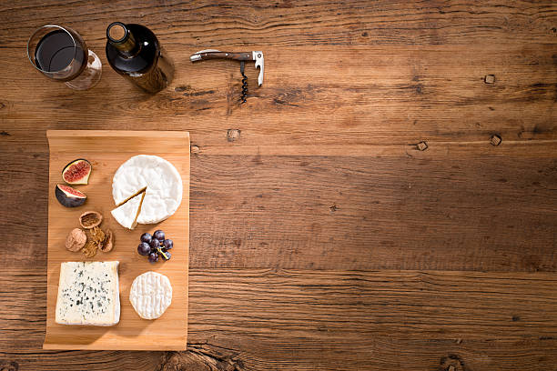 istock above view flatlay assortment cheese and wine wooden table copyspace 636320060
