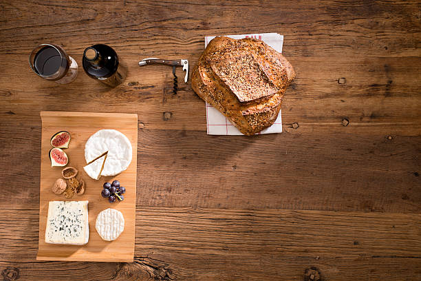 istock above view flatlay assortment cheese and wine wooden table copyspace 636320836