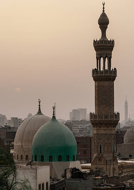 istock Sunset in dusty Cairo with mosque and minaret 636321604
