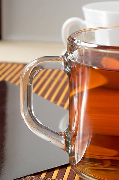 istock Large transparent glass mug with tea 636322544