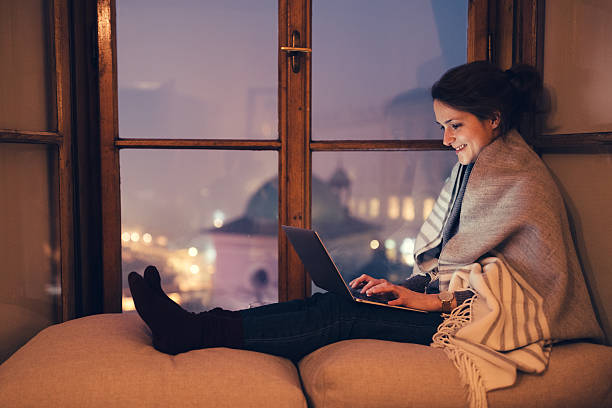 Woman working on laptop at home