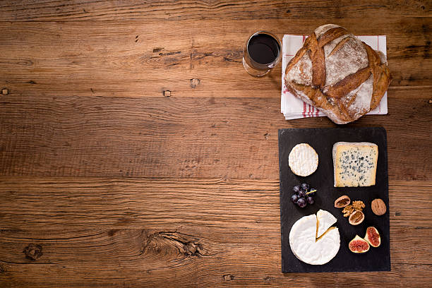 istock above view flatlay assortment cheese and wine wooden table copyspace 636324524