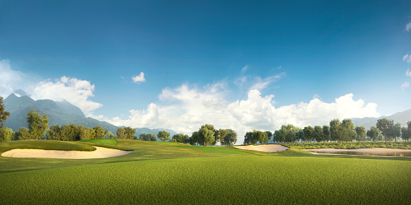 View of the green rolling landscape and bunkers or sand traps at Golf course. The golf field is made in 3D.