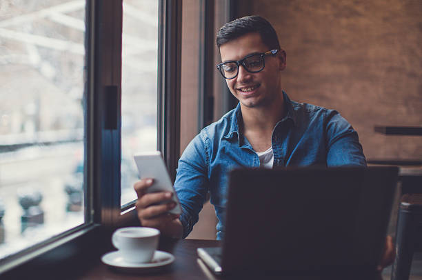 istock Man surfing the net in cafe 636328092