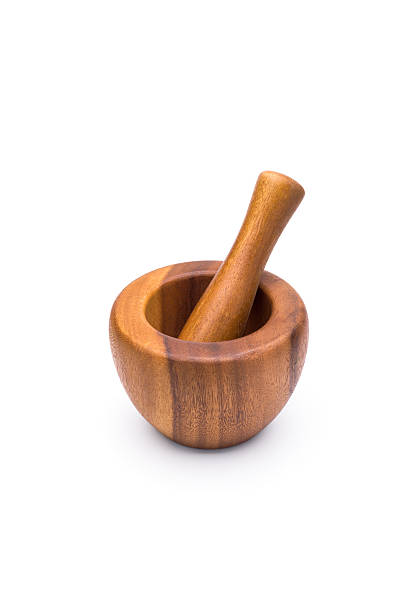 istock wooden mortar on a white background 636329608