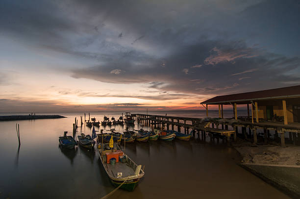 istock Boats on water in sunset 636330562