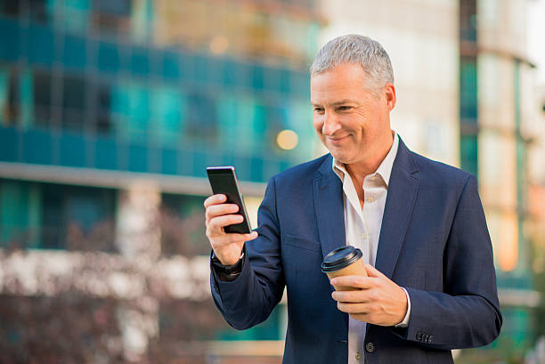 istock Businessman communicating on cellphone 636330622