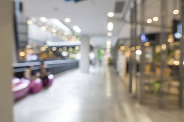 istock Abstract Blur indoor hall modern Shopping mall for background 636330926