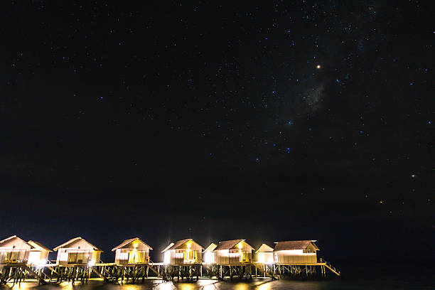 istock Overwater bungalows in Maldives in the night 636334538