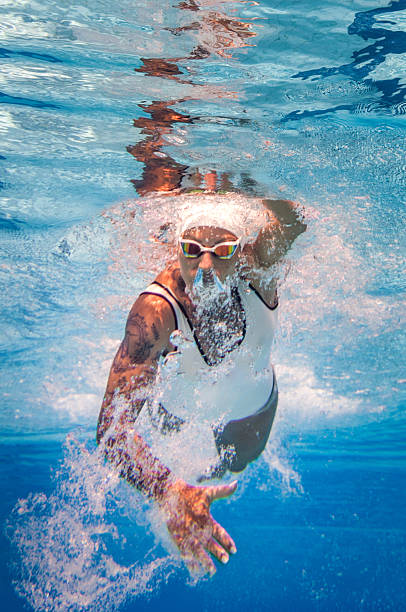 istock Freestyle swimming sprint, underwater image 636335946