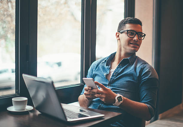 istock Man surfing the net in cafe 636336060