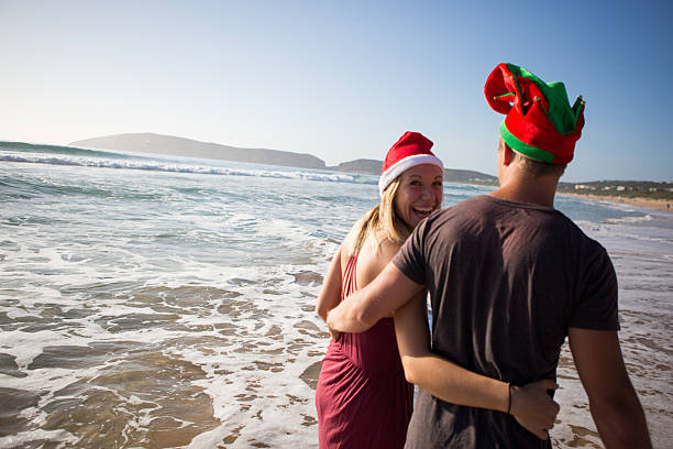 istock Playful couple on a summer Christmas holiday! 636336502