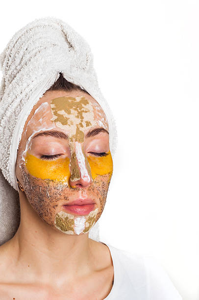 istock Woman with different masks on her face multi-masking 636340752