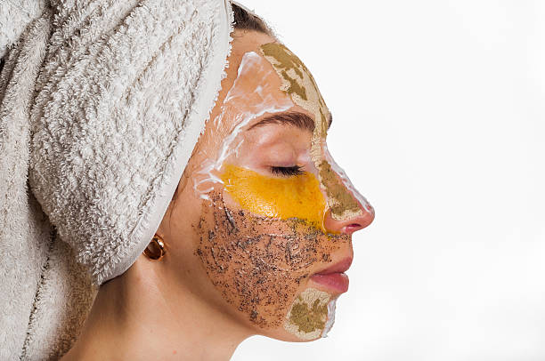 istock Woman with different masks on her face multi-masking 636340798