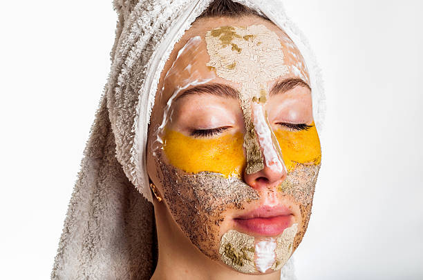 istock Woman with different masks on her face multi-masking 636340984