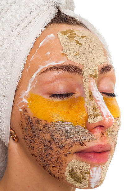 istock Woman with different masks on her face multi-masking 636341034