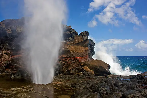 Ocean blowing through lave tube blowhole in Maui