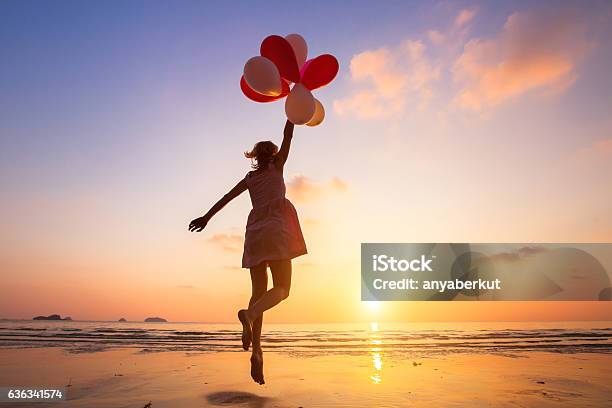 Imagination Happy Girl Flying On Multicolored Balloons Dreamer Stock Photo - Download Image Now