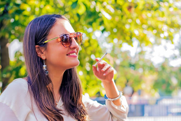 istock woman smoking a cigarette 636341644
