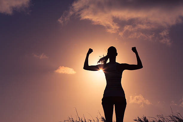 potere femminile! - human muscle bicep power flexing muscles foto e immagini stock