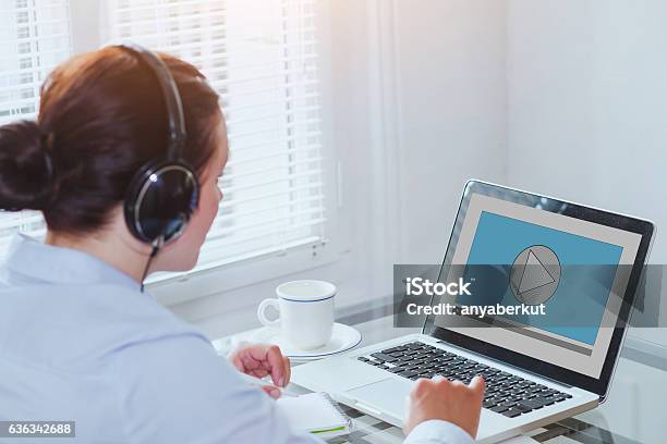 Watch Video Using A Computer Woman Watching Video Tutorial On Computer Stock Photo - Download Image ...