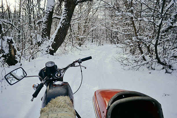 istock Motorcycles with sidecars in winter forest 636343236