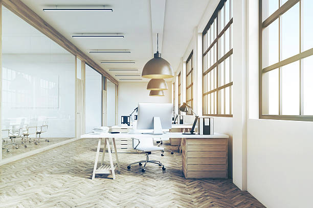istock Front view of a long office with wooden floor, toned 636344076