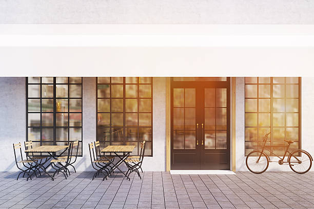 istock Cafe exterior with tables and bike, toned 636344170