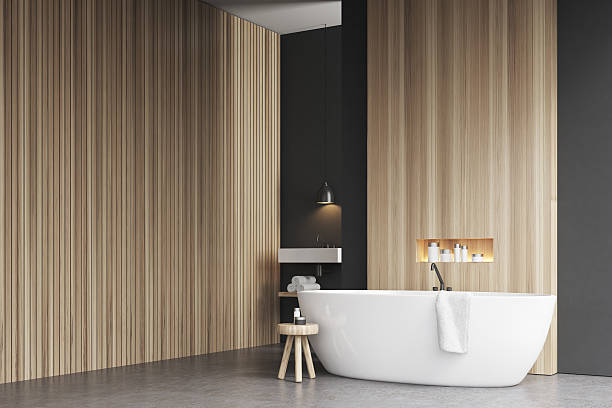 istock Bathroom corner with bathtub and wooden wall 636344448
