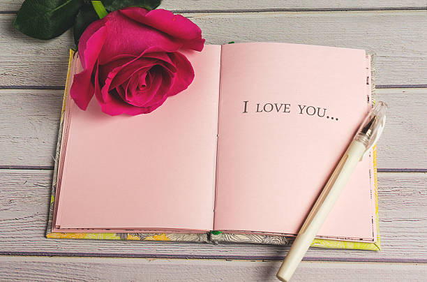 istock Romantic composition with rose flowers and text I love you 636345724