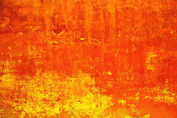 istock Rough wall of bright red-yellow color 636345888