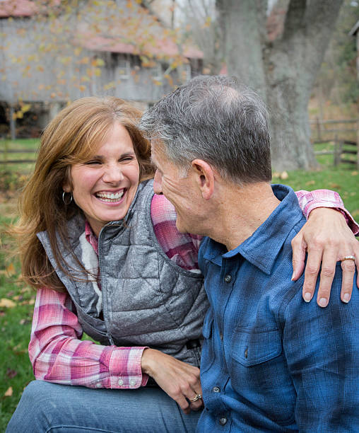 istock Mature Couple smiling laughing together 636346424