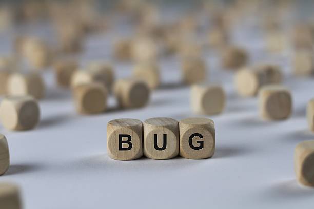istock bug - cube with letters, sign with wooden cubes 636347036