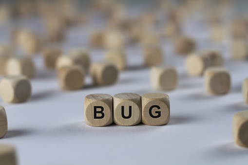 bug - cube with letters, sign with wooden cubes