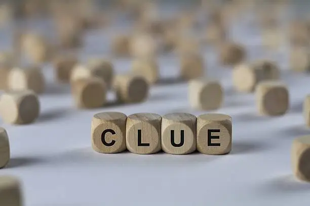 clue - cube with letters, sign with wooden cubes