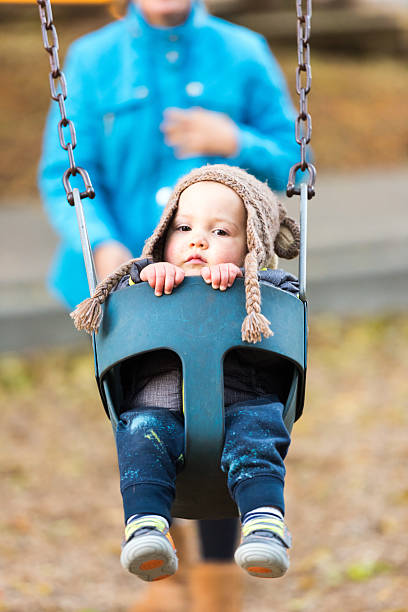 istock Mother and baby having fun in a park 636349910