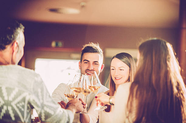 istock Friends Enjoying Dinner in a Restaurant 636350164