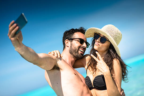 istock Happiness couple at the seaside take a selfie 636350698
