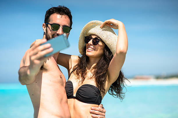 istock Happiness couple at the seaside take a selfie 636350736