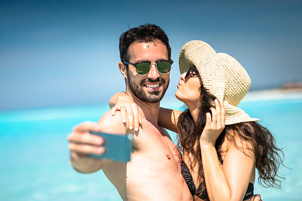 istock Happiness couple at the seaside take a selfie 636350786