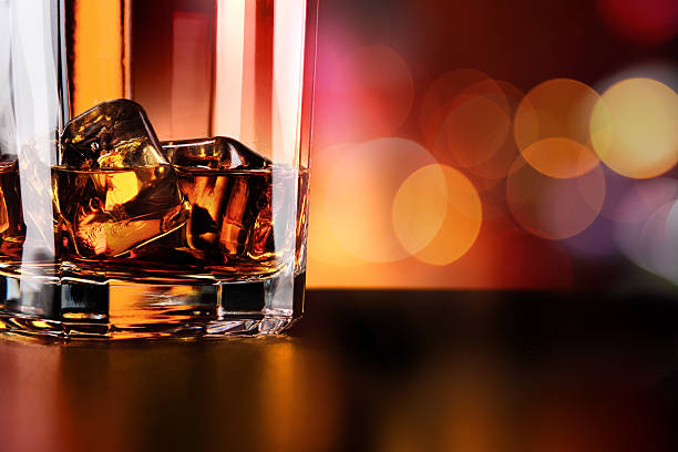 istock Whisky glass and bottle on the bar 636351398