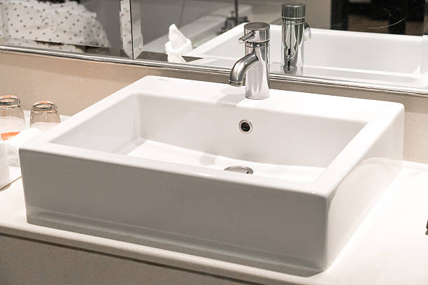 istock Bathroom interior with sink and faucet 636351620