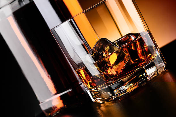 istock Whisky glass and bottle on the bar 636351632