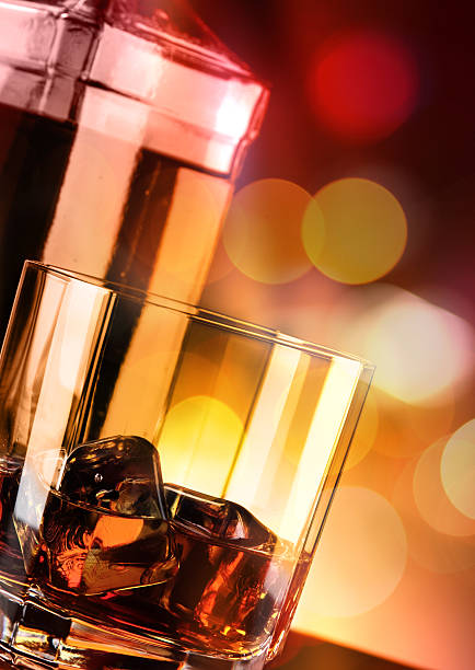 istock Whisky glass and bottle on the bar 636351704